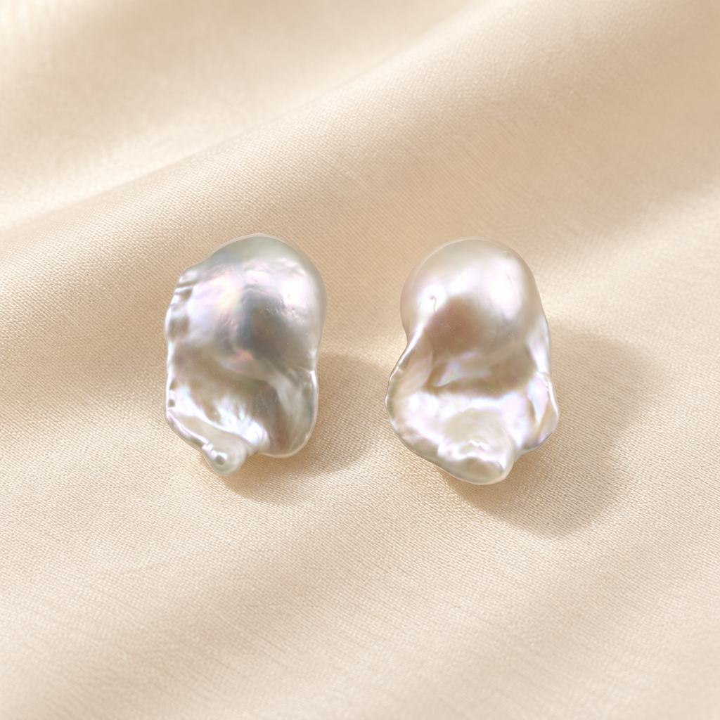 VEEKISSY elegant baroque pearl stud earrings, pair on ivory fabric