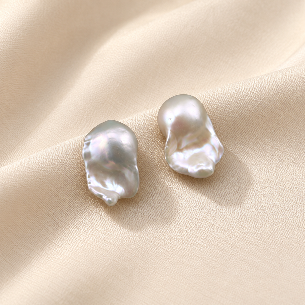 VEEKISSY elegant baroque pearl stud earrings, alternative pair angle on cream fabric