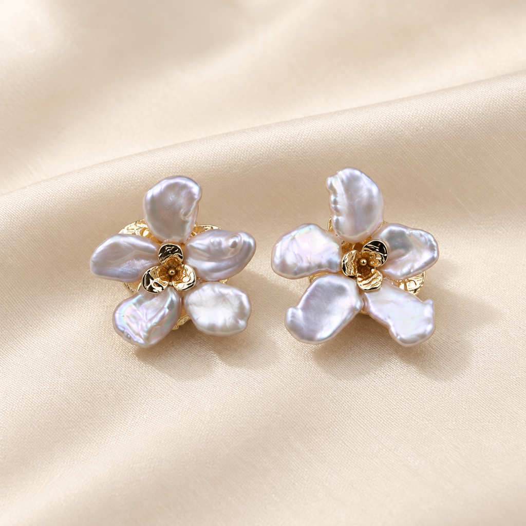 VEEKISSY floral baroque pearl stud earrings, pair on ivory fabric