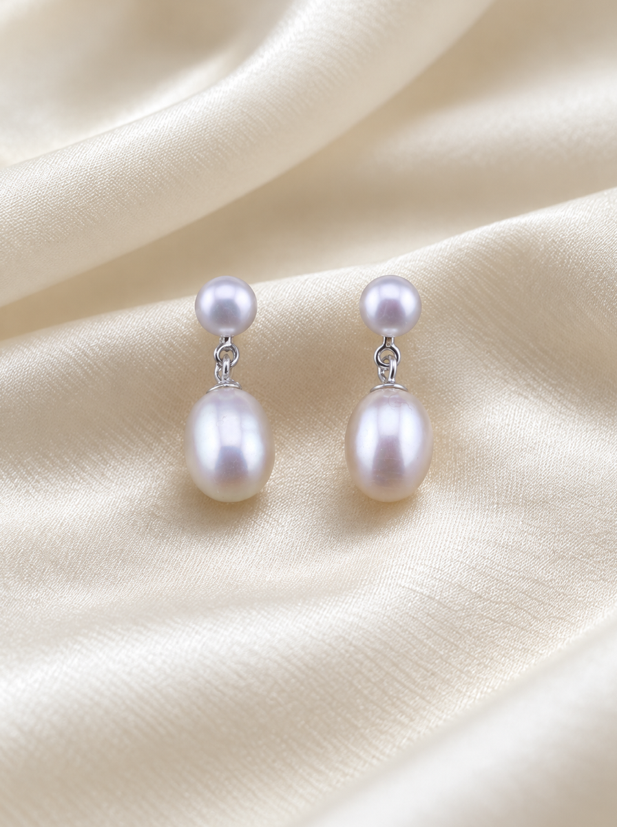 VEEKISSY classic double pearl earrings, front pair on ivory fabric