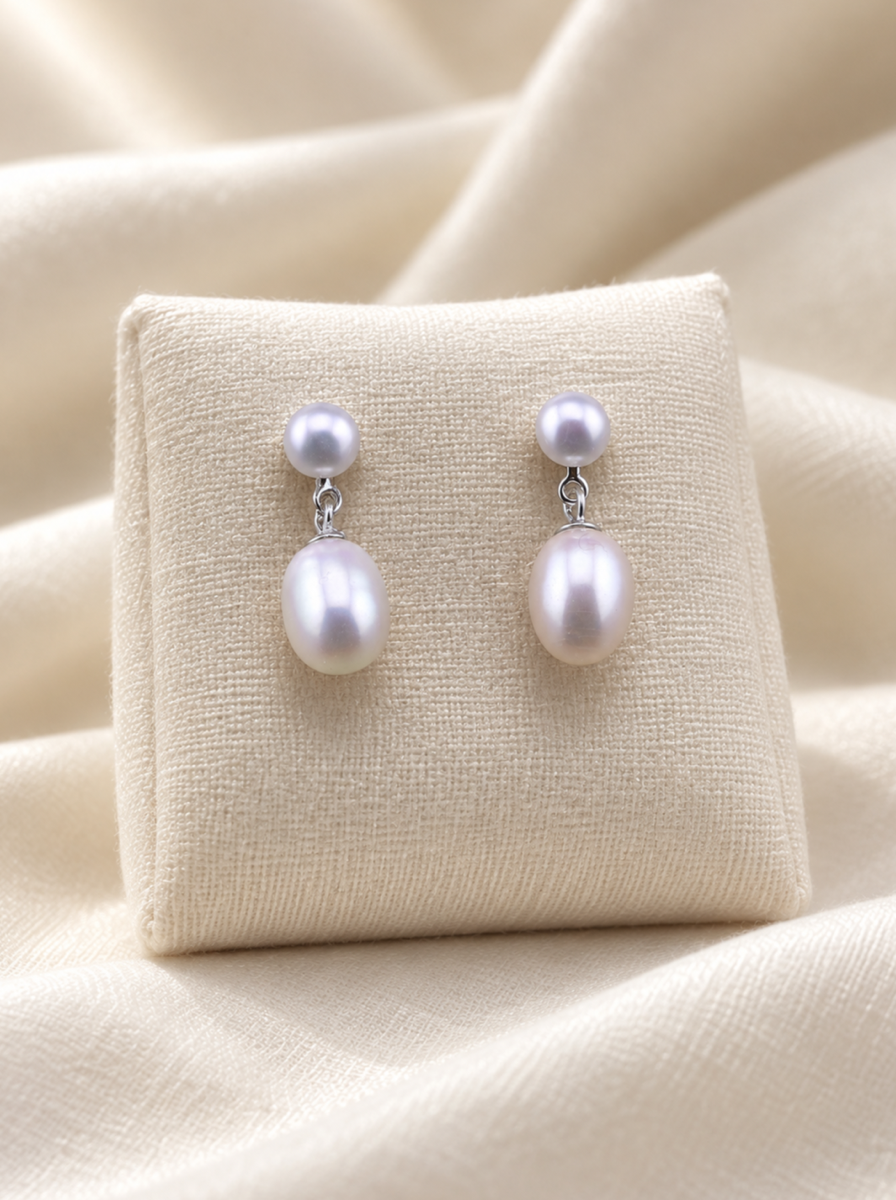 VEEKISSY classic double pearl earrings, pair on ivory display cushion