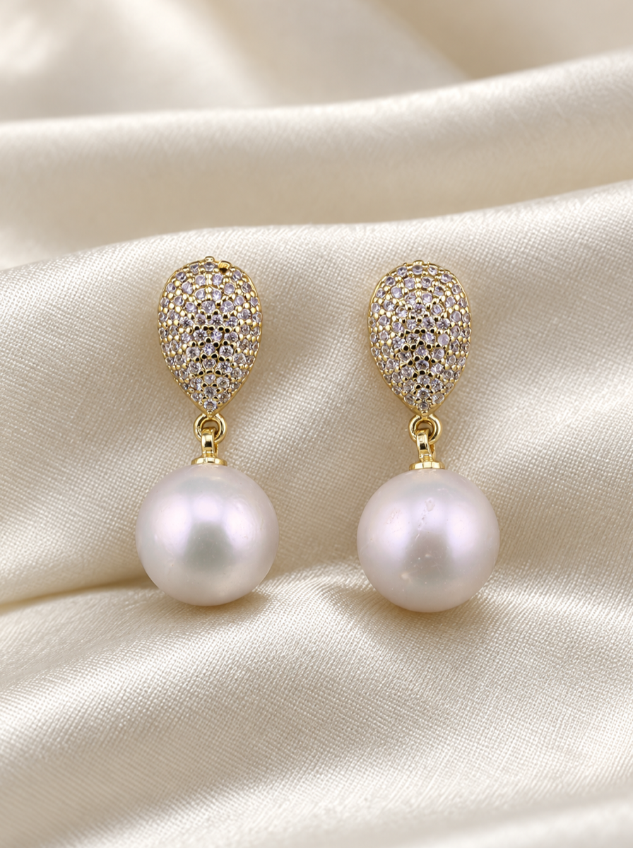 VEEKISSY edison pearl drop earrings, front pair on ivory fabric